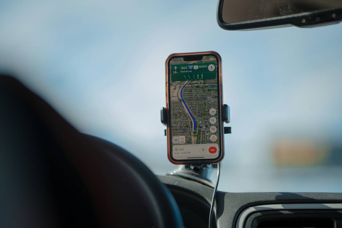 Location Spoofing Guides showing a smartphone with GPS coordinates altered on a world map